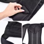 Close-up of a hand adjusting a black ergonomic posture support belt.